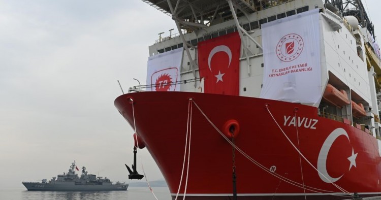 A picture taken at the port of Dilovasi, outside Istanbul, on June 20, 2019 shows the drilling ship 'Yavuz' scheduled to search for oil and gas off Cyprus, next to a warship.