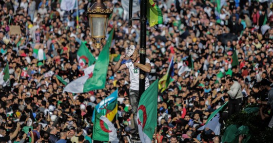 Algerians take part in an anti-government demonstration demanding the ouster of officials who served under ex-president Abdelaziz Bouteflika as they marked the 65th anniversary of the country's fight for independence from France. 