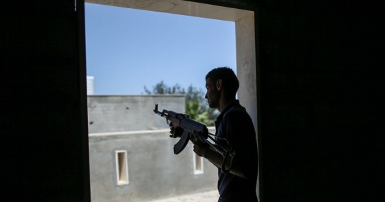 A fighter of Libya's UN-backed Government of National Accord (GNA) of Fayez Serraj, fires his rifle during clashes with forces of the self-styled Libyan National Army (LNA) led by Libyan strongman Khalifa Haftar, at Al-Khalla frontline. 