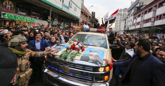 Mourners surround a car carrying the coffins of Iranian military commander Qasem Soleimani and Iraqi paramilitary chief Abu Mahdi al-Muhandis, killed in a US air strike, during their funeral procession in Kadhimiya, a Shiite pilgrimage district of Baghdad, on January 4, 2020. 