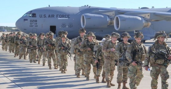 U.S. Army Paratroopers assigned to the 2nd Battalion, 504th Parachute Infantry Regiment, 1st Brigade Combat Team, 82nd Airborne Division, deploy from Pope Army Airfield, North Carolina on January 1, 2020. 