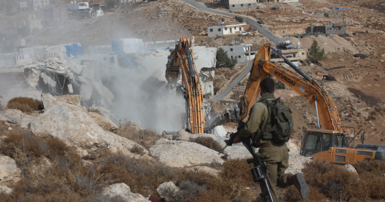MIDEAST-HEBRON-HOUSE-DEMOLITION  Israeli bulldozers demolish a Palestinian house, which is believed to have been built without permit, in Bani Naim town near the West Bank city of Hebron, Oct. 25, 2022. (Photo by Mamoun Wazwaz/Xinhua via Getty Images)
