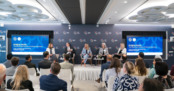 Image showing the panelists on the stage at MEI.