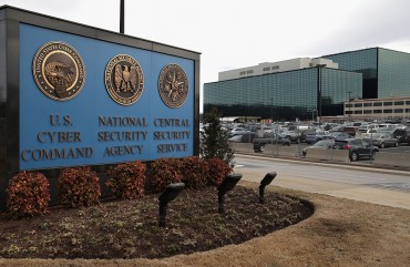 he seals of the U.S. Cyber Command, the National Secrity Agency and the Central Security Service greet employees and visitors at the campus the three organizations share March 13, 2015 in Fort Meade, Maryland.
