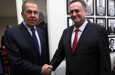 Russia's Foreign Minister Sergei Lavrov (L) and Israel's Foreign Minister Yisrael Katz shake hands during a meeting on the sidelines of the 74th session of the UN General Assembly at the headquarters of the United Nations in Manhattan. 