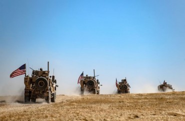 A US military convoy takes part in joint patrol with Turkish troops in the Syrian village of al-Hashisha on the outskirts of Tal Abyad town along the border with Turkish troops, on September 8, 2019.