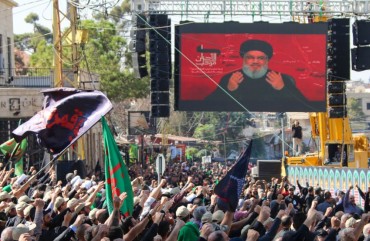 Shiite Muslims watch a televised speech by Hassan Nasrallah, the Lebanese Shiite Hezbollah movement leader, in the city of Baalbek in Lebanon's eastern Bekaa Valley on October 19, 2019.