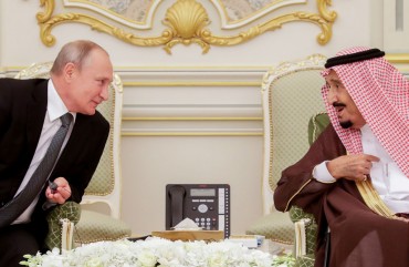 Russia's President Vladimir Putin (L) and King Salman bin Abdulaziz Al Saud of Saudi Arabia at a ceremony to sign joint documents following Russian-Saudi talks at the Al-Yamamah Royal Palace. 