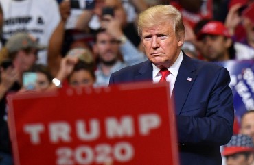US President Donald Trump looks on during a rally at the Amway Center in Orlando, Florida to officially launch his 2020 campaign on June 18, 2019.