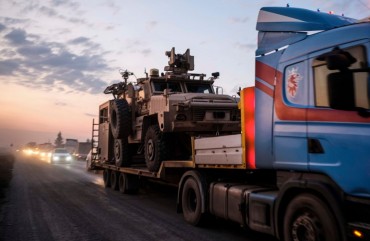 A convoy of U.S. armored military vehicles leave Syria on a road to Iraq on October 19, 2019 in Sheikhan, Iraq.