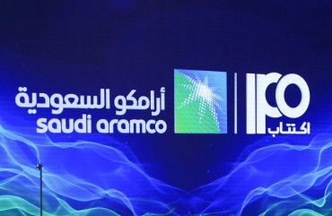 A picture taken on November 3, 2019 shows a sign of Saudi Aramco's initial public offering (IPO) during a press conference by the state company in the eastern Saudi Arabian region of Dhahran.