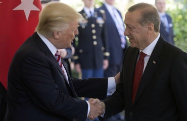 US President Donald Trump shakes hands with Turkish President Recep Tayyip Erdogan as he arrives for meetings at the White House in Washington, DC, May 16, 2017.
