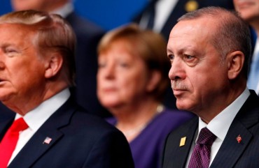 US President Donald Trump (L) and Turkey's President Recep Tayyip Erdogan (R) pose for the family photo at the NATO summit at the Grove hotel in Watford, northeast of London on December 4, 2019.