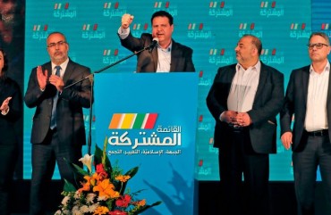 Ayman Odeh (C), leader of the Hadash party that is part of the Joint List alliance, gives an address with other alliance leaders at their electoral headquarters in Israel's northern city of Shefa-Amr on March 2, 2020, after polls officially closed.