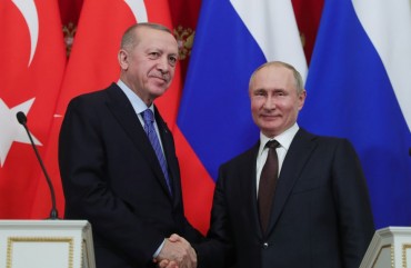 President of Turkey Recep Tayyip Erdogan (L) and President of Russia Vladimir Putin (R) shake hands at the end of a joint news conference following an inter-delegation meeting at Kremlin Palace in Moscow, Russia on March 5, 2020.