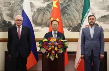 Photo by Lintao Zhang/Pool/AFP via Getty Images