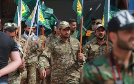 Members of the the predominantly Shia Muslim PMF take part in a PMF conference to honor Iranian fighters who died fighting ISIS