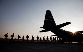 American soldiers board a US Airforce C130 at Baghdad Airport. 