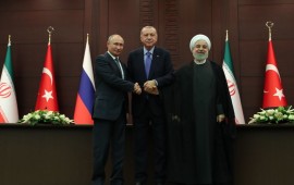 President of Turkey Recep Tayyip Erdogan (C), President of Russia Vladimir Putin (L) and President of Iran Hassan Rouhani (R) shake hands as they pose for a photo after a joint press conference following the Turkey-Russia-Iran trilateral summit at Cankaya Mansion in Ankara, Turkey on September 16, 2019. 
