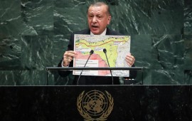 President of Turkey Recep Tayyip Erdogan holds up a map of the safe zone Turkey in in favor of while speaking to the United Nations General Assembly at UN headquarters on September 24, 2019 in New York City. 