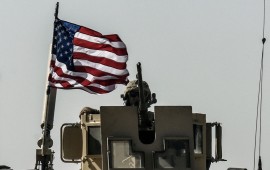 A US military convoy drives on a highway from Kobane to Ain Issa on September 29, 2017. After a months-long campaign, the Syrian Democratic Forces -- a US-backed alliance of Arab and Kurdish fighters -- have cornered diehard jihadists in a pocket of territory in the battered northern city of Raqa. / AFP PHOTO / BULENT KILIC (Photo credit should read BULENT KILIC/AFP/Getty Images)