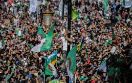 Algerians take part in an anti-government demonstration demanding the ouster of officials who served under ex-president Abdelaziz Bouteflika as they marked the 65th anniversary of the country's fight for independence from France. 