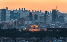 The sunset casts an orange sky over the new urban skyline of Turkey's capital city, Ankara, which is centered around the Anitkabir, the memorial tomb of the country's founding father Mustafa Kemal Ataturk.