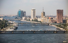A complete overview of the Ramses Hilton Hotel (R), the Maspero Television Building (C) and the building of the Egyptian Ministry of Foreign Affairs with a view of the Qasr El Nil Bridge (front) on the banks of the Nile. 