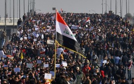 Iraqi students, waving national flags, join anti-government protests in the Shiite shrine city of Najaf in central Iraq on January 28, 2020.