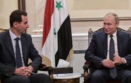 Syria's President Bashar al-Assad (L) and Russia's President Vladimir Putin during a meeting in the Cathedral of Our Lady of the Dormition. 
