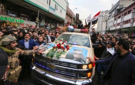 Mourners surround a car carrying the coffins of Iranian military commander Qasem Soleimani and Iraqi paramilitary chief Abu Mahdi al-Muhandis, killed in a US air strike, during their funeral procession in Kadhimiya, a Shiite pilgrimage district of Baghdad, on January 4, 2020. 