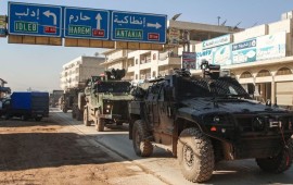 A Turkish military convoy of tanks and armoured vehicles passes through the Syrian town of Dana, east of the Turkish-Syrian border in the northwestern Syrian Idlib province, on February 2, 2020.