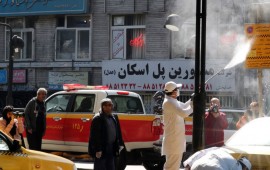 Iranian fire fighters and municipality workers disinfect a street in the capital Tehran for corona virus COVID-19 on March 5, 2020. 