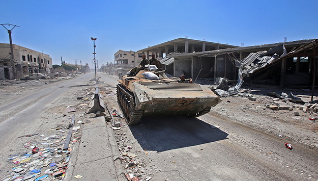 Syrian government soldiers take possession in Daraa province