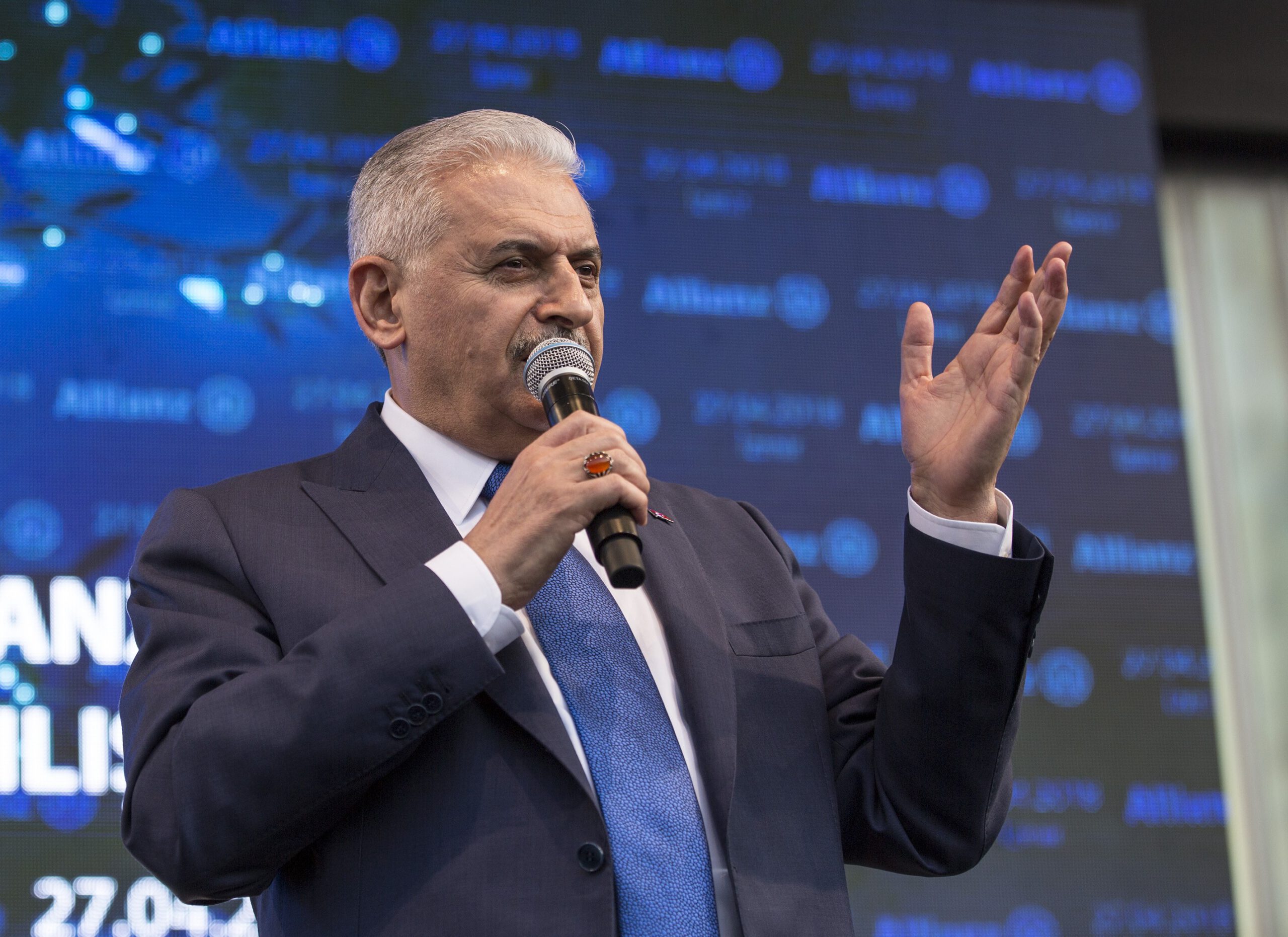 Turkish Prime Minister Binali Yildirim makes a speech during the ribbon-cutting ceremony of insurance firm Allianz's campus in Gaziemir, Izmir, Turkey on April 27, 2018. 