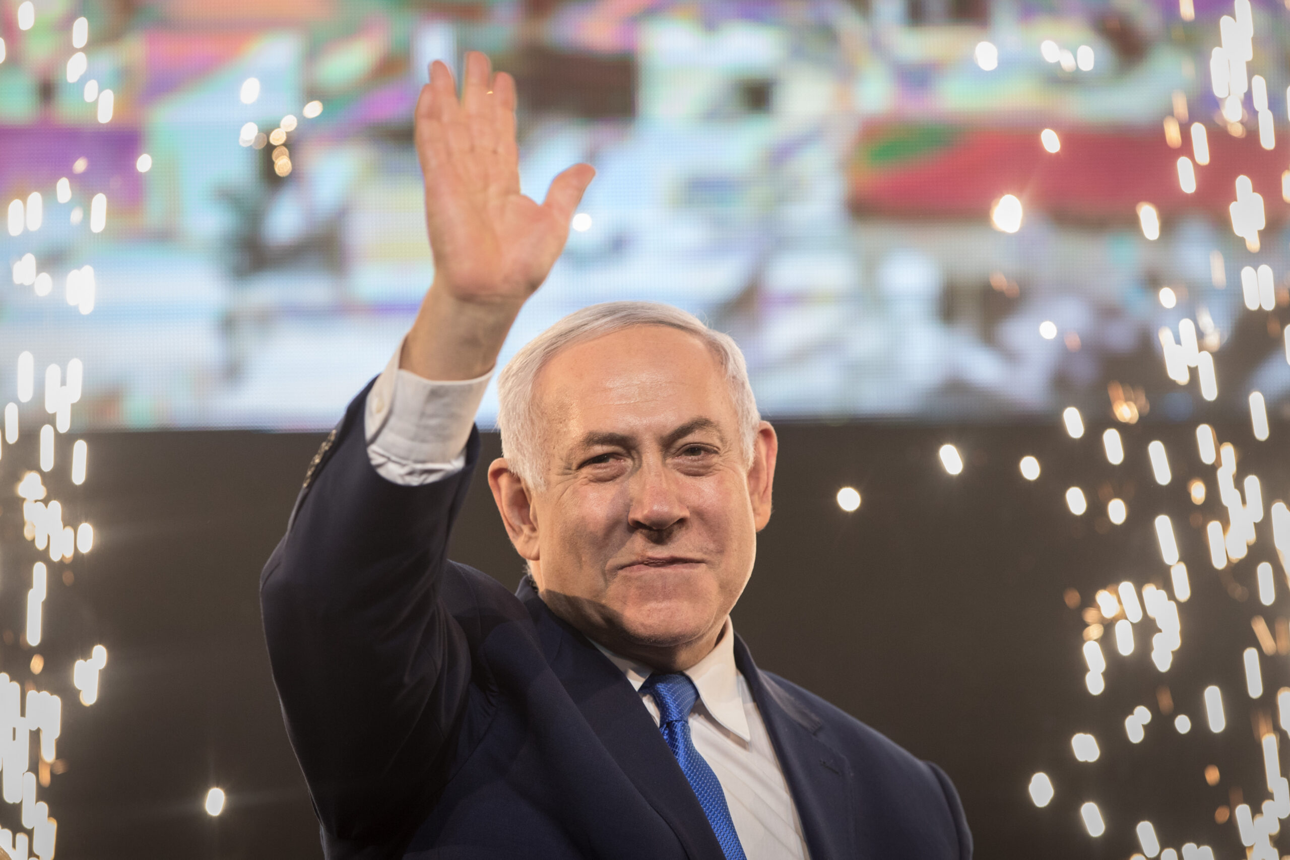 Benjamin Netanyahu, Prime Minister of Israel, beckons supporters after the polling stations have been closed.