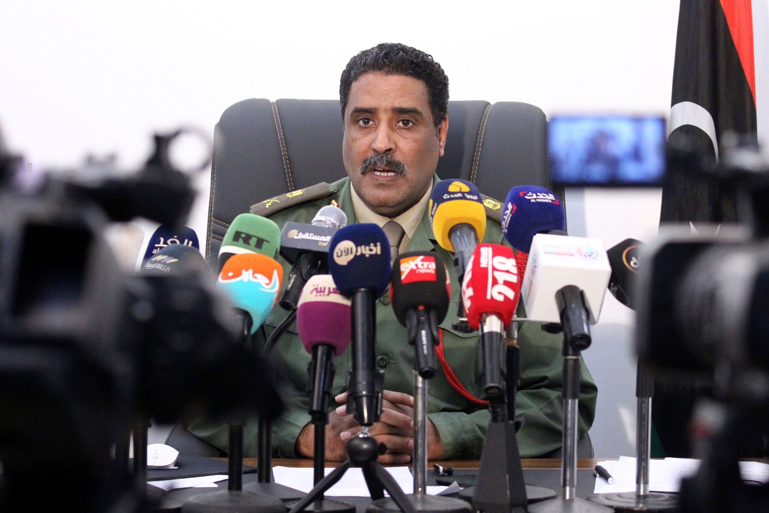 Brigadier Ahmed al-Mesmari, spokesman of the self-proclaimed Libyan National Army loyal to Khalifa Haftar, speaks during a press conference in his office in Benghazi on April 8, 2019. 