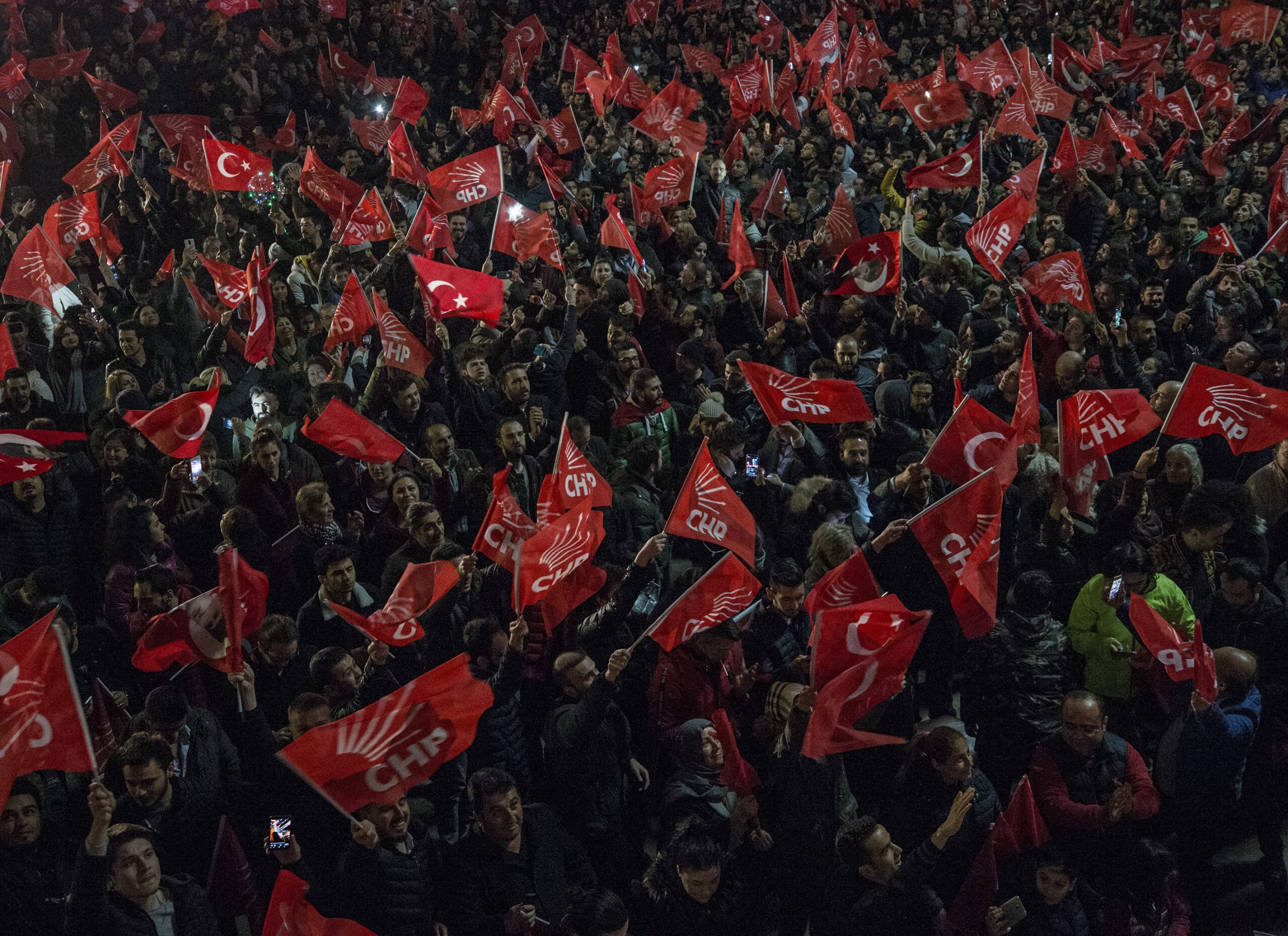 People wait outside of the Republican People's Party (CHP) Headquarters after voting ended for the local elections in Ankara, Turkey on April 01, 2019.