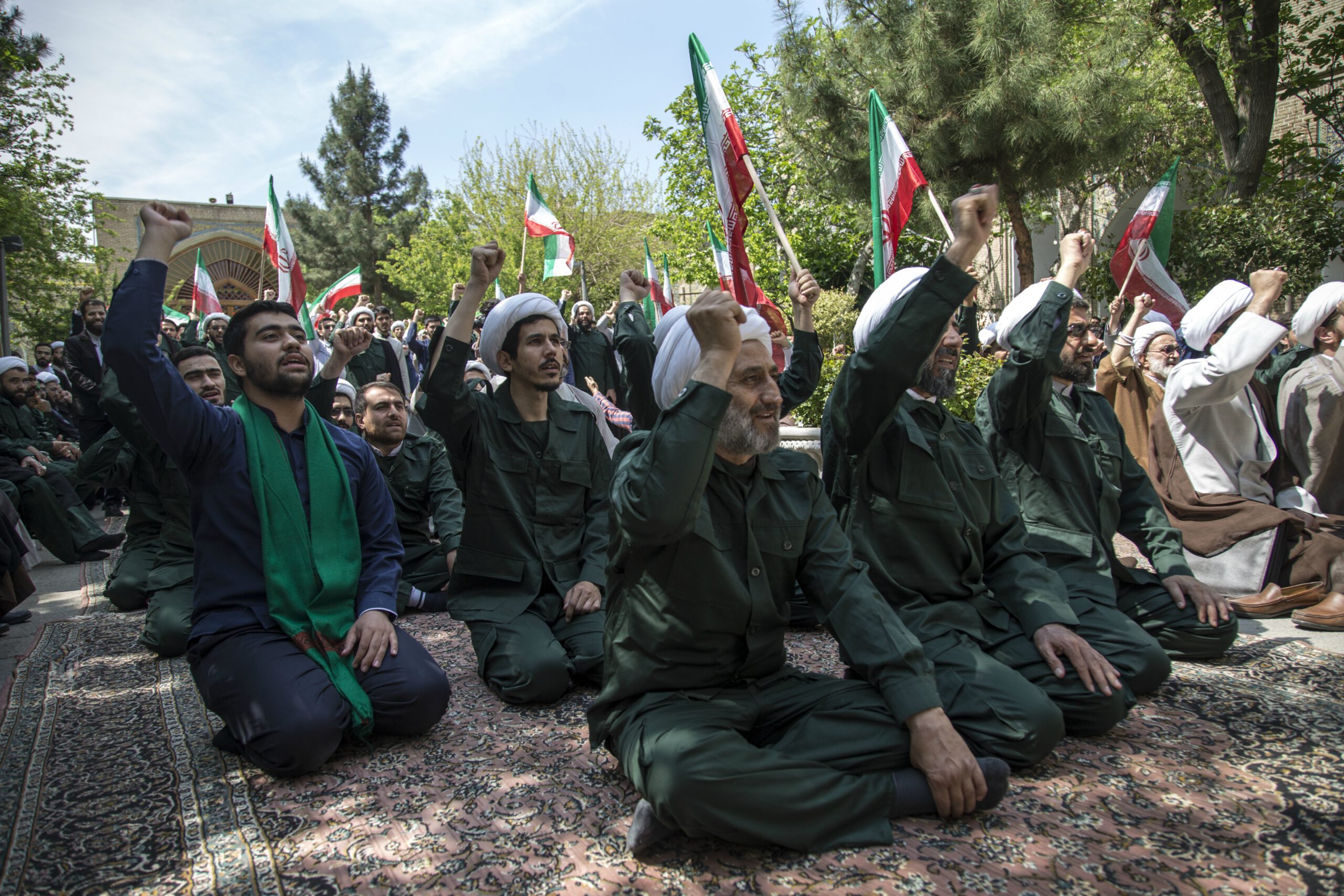 Iranian Clerics chant slogans during an anti-US rally in Tehran on April 14, 2019.