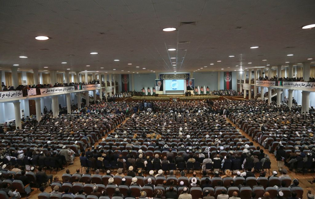 Afghan people attend the first day of the 