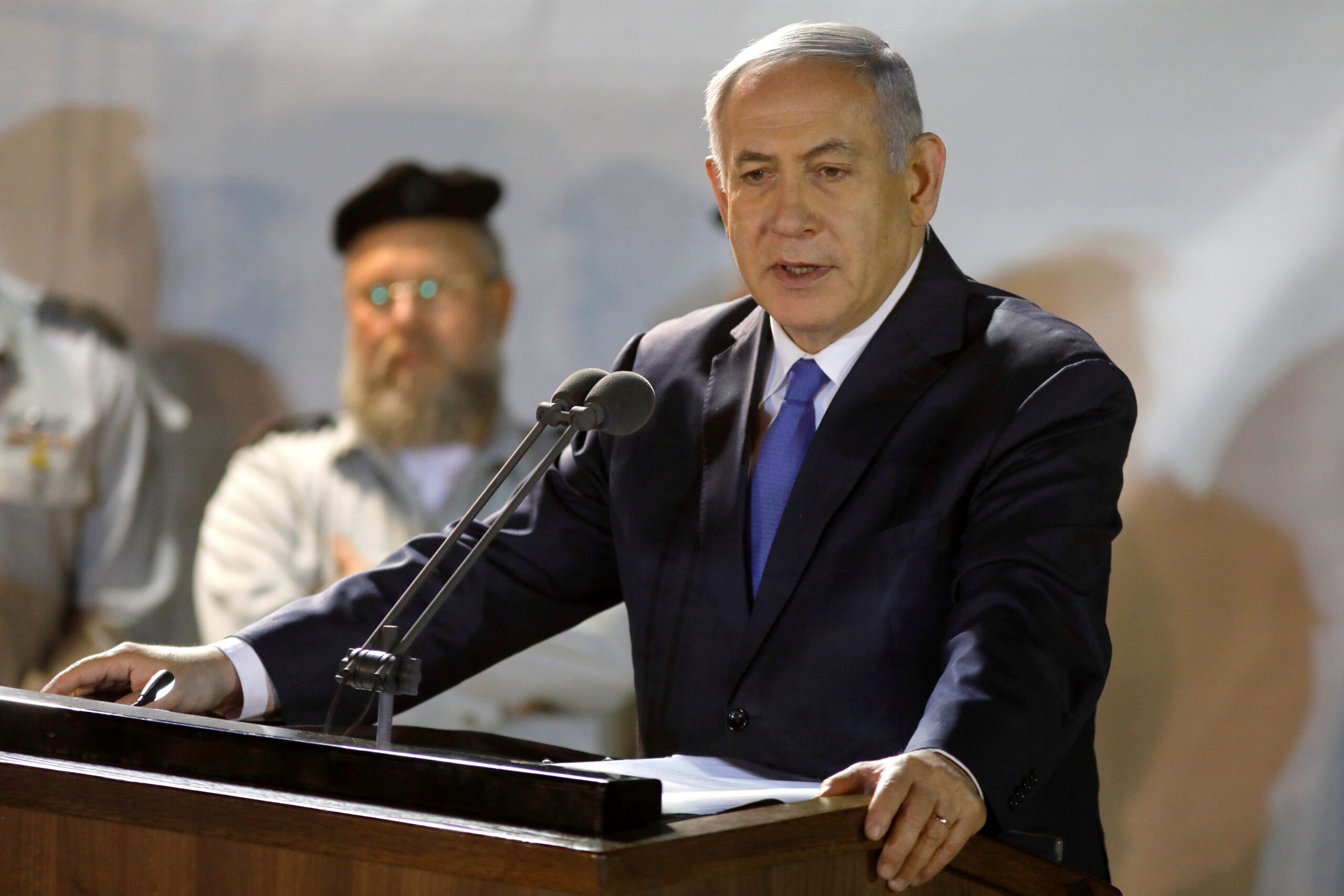 Prime Minister Benjamin Netanyahu (R) attends the funeral of Sergeant First Class Zachary Baumel at the Mount Herzl military cemetery in Jerusalem on April 4 2019.