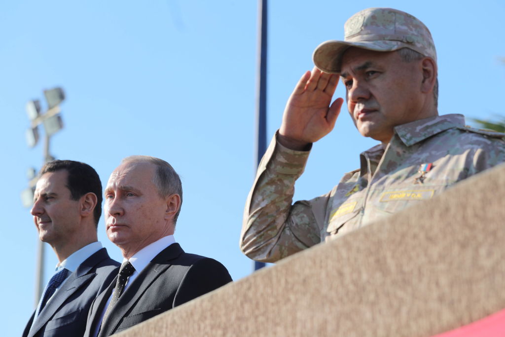 Syria's President Bashar al-Assad, Russia's President Vladimir Putin, and Russia's Defence Minister Sergei Shoigu (L-R) at the Russian Hmeimim air base. 