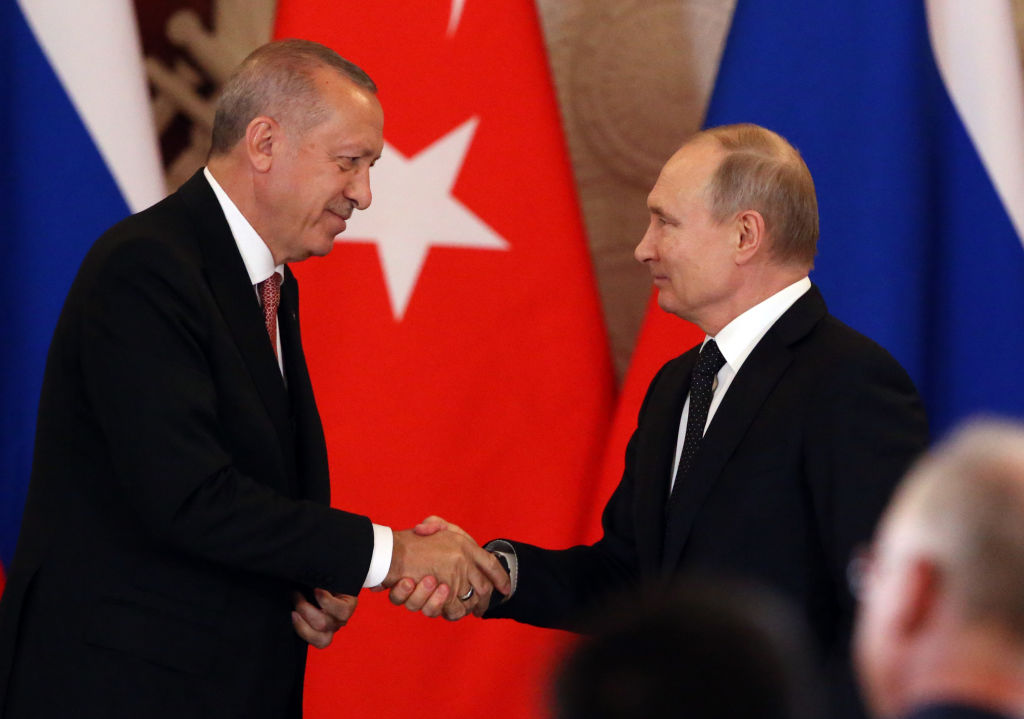 Russian President Vladimir Putin (R) greets Turkish President Recep Tayyip Erdogan (L) during their joint press conference at the Grand Kremlin Palace on April 8, 2019 in Moscow, Russia. Turkish President Erdogan is having a one-day state visit to Russia. (Photo by Mikhail Svetlov/Getty Images)