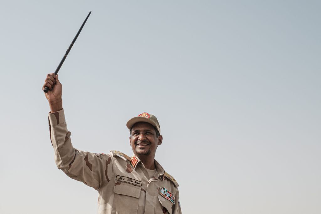 Mohamed Hamdan Dagalo, known as Himediti, deputy head of Sudan's ruling Transitional Military Council (TMC) and commander of the Rapid Support Forces (RSF) paramilitaries, waves a baton to supporters on a vehicle as he arrives for a rally in the village of Abraq, about 60 kilometers northwest of Khartoum, on June 22, 2019. (YASUYOSHI CHIBA/AFP/Getty Images)