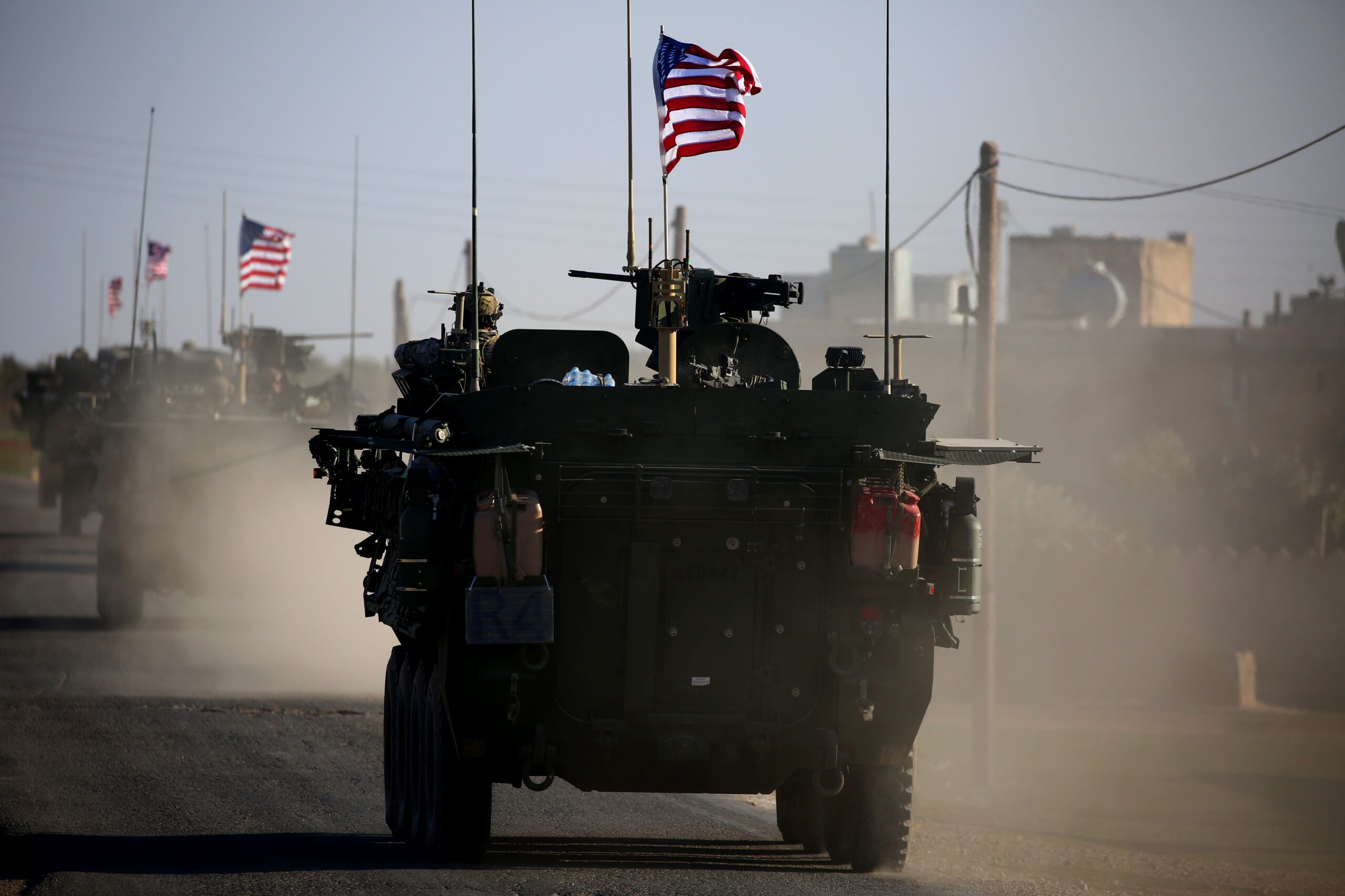 TOPSHOT - A convoy of US forces armoured vehicles drives near the village of Yalanli, on the western outskirts of the northern Syrian city of Manbij, on March 5, 2017. / AFP PHOTO / DELIL SOULEIMAN (Photo credit should read DELIL SOULEIMAN/AFP/Getty Images)