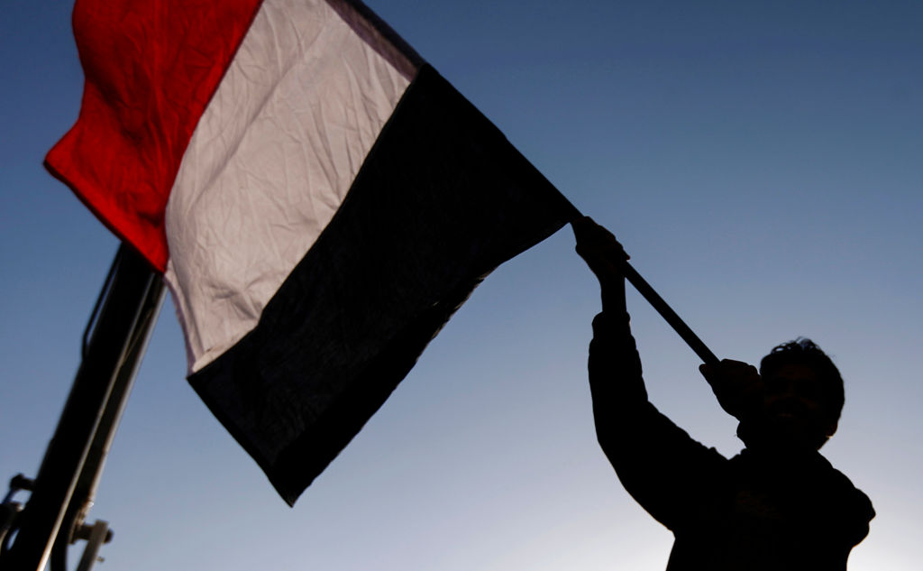 A Yemeni waves a national flag during a rally celebrating the death of Yemeni ex-president Ali Abdullah Saleh a day after he was killed, in the capital Sanaa on December 5, 2017. 