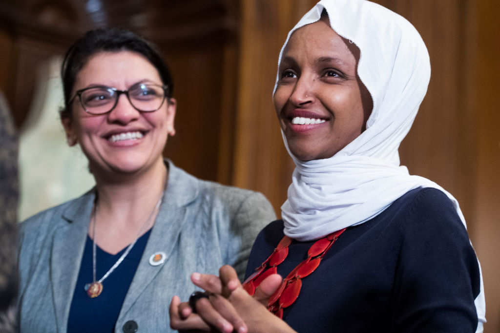 Reps. Ilhan Omar, D-Minn., right, and Rashida Tlaib, D-Mich., attend a rally with Democrats in the Capitol to introduce the 