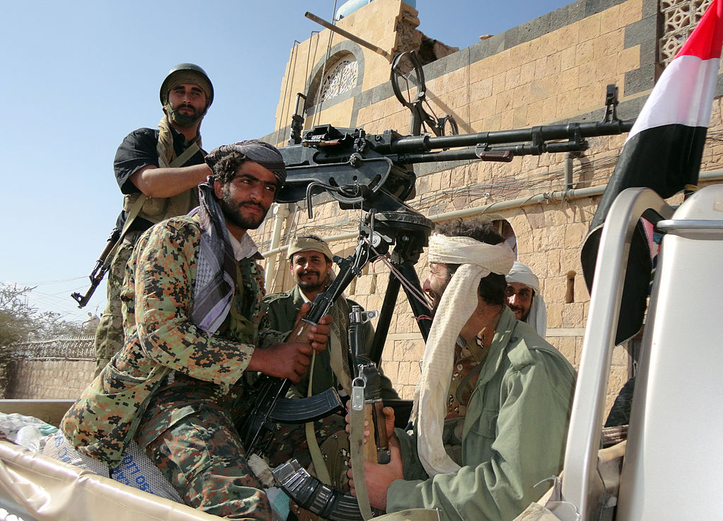 Supporters of al-Qaeda tote their rifles in the back of a pick-up truck in the town of Rada, 130 kilometres (85 miles) southeast of the capital Sanaa, on January 23, 2012.