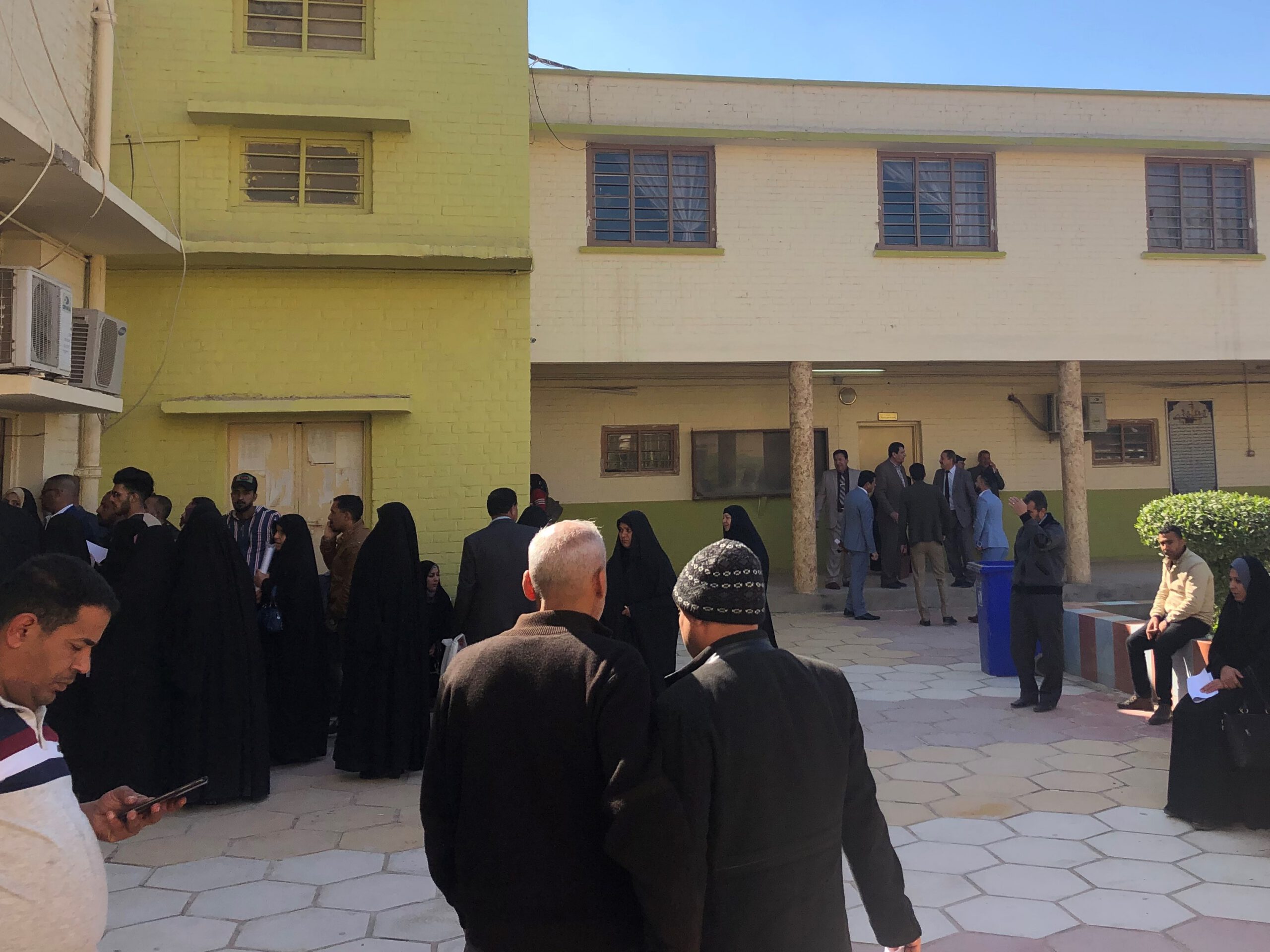 Iraqis waiting to have their paperwork signed at a directorate in Diwaniyah. 