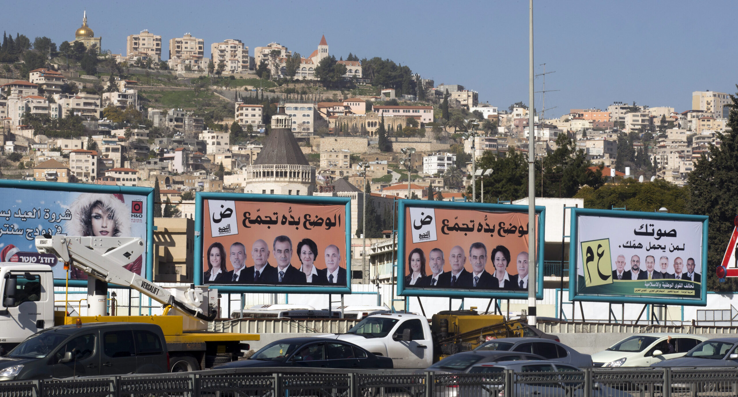 Election campaign posters of Israeli-Arab candidates running for the parliamentary elections are seen in the northern Arab-Israeli city of Nazareth on January 14, 2013. 